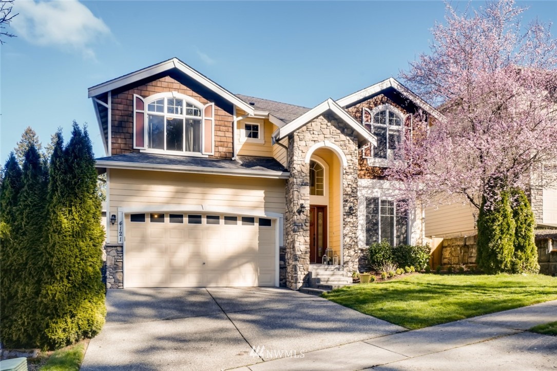 4121 223rd Place Southeast Bothell, WA 98021 - Photo 1 of 15 a front view of a house with a yard