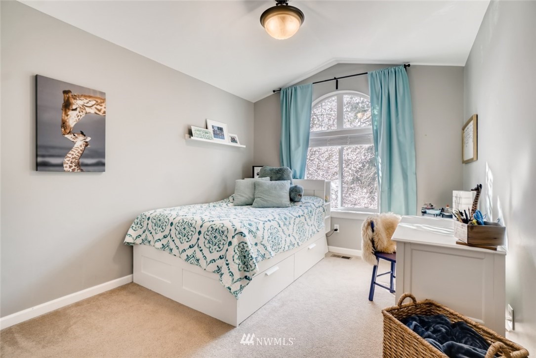 4121 223rd Place Southeast Bothell, WA 98021 - Photo 12 of 15 a bedroom with a bed and a window
