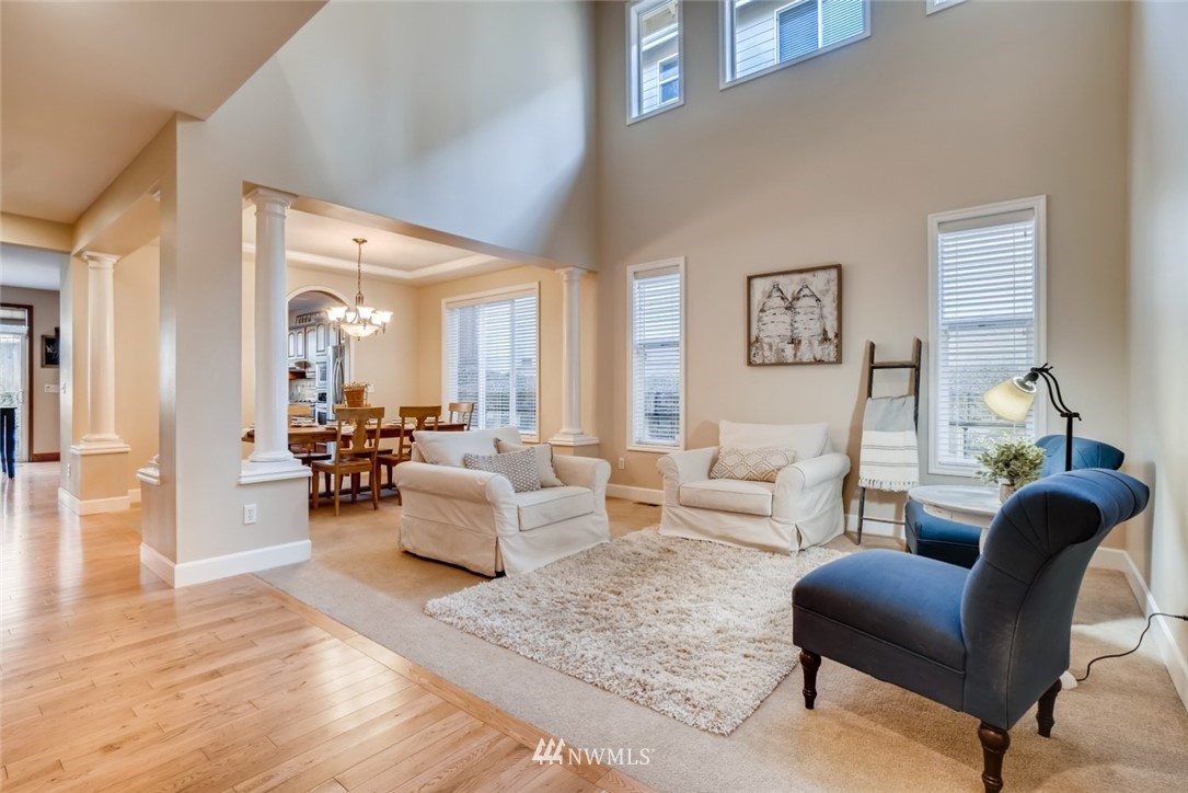 4121 223rd Place Southeast Bothell, WA 98021 - Photo 3 of 15 a living room with furniture and a large window