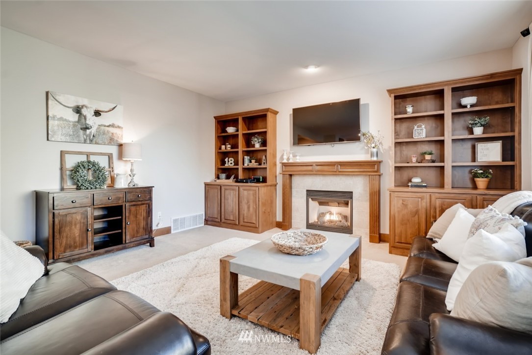 4121 223rd Place Southeast Bothell, WA 98021 - Photo 7 of 15 a living room with furniture and a flat screen tv