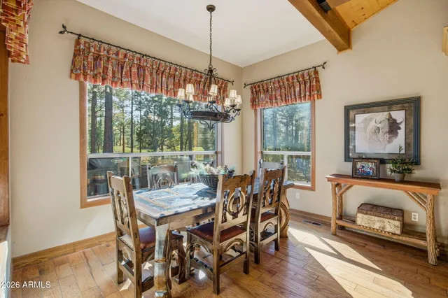 a kitchen with sink a stove and chairs