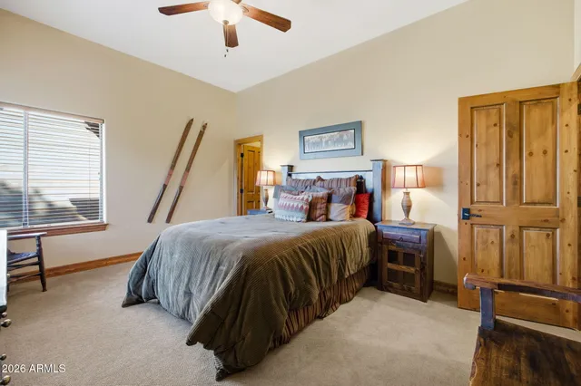 a bathroom with a double vanity sink mirror and shower