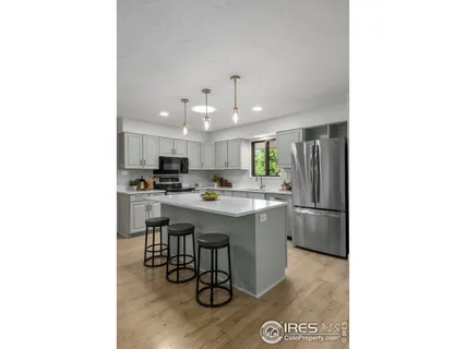 a kitchen with a dining table and chairs