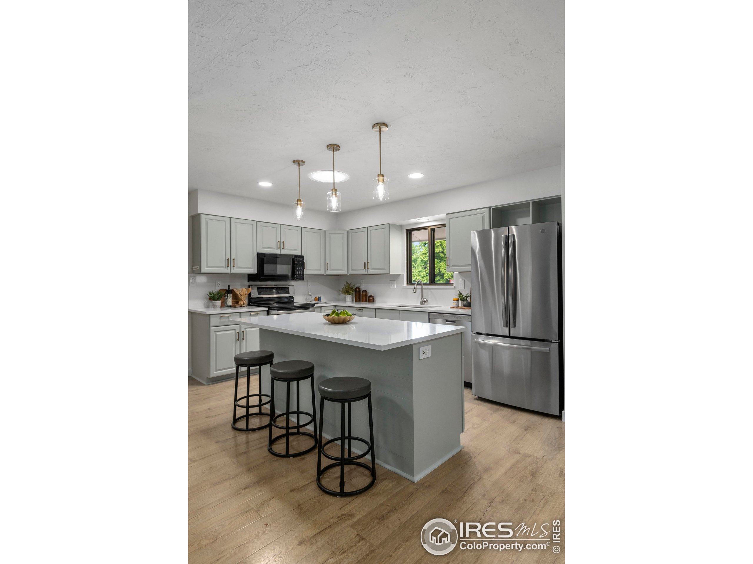 1917 South Lemay Avenue Fort Collins, CO 80525 - Photo 14 of 50 a kitchen with a sink cabinets and stainless steel appliances