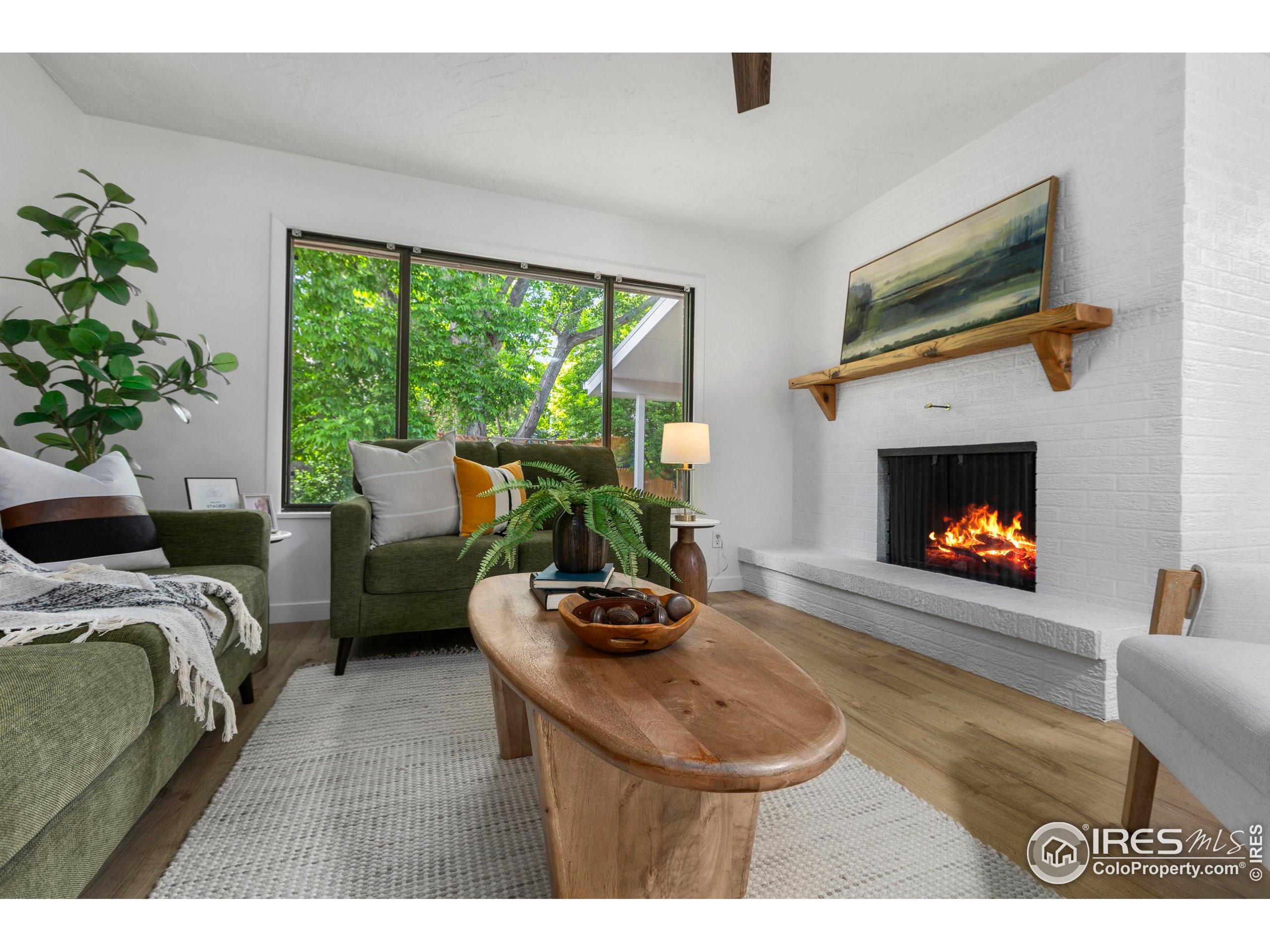 1917 South Lemay Avenue Fort Collins, CO 80525 - Photo 20 of 50 a living room with furniture and a fireplace