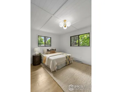 a bathroom with a sink vanity granite and a mirror