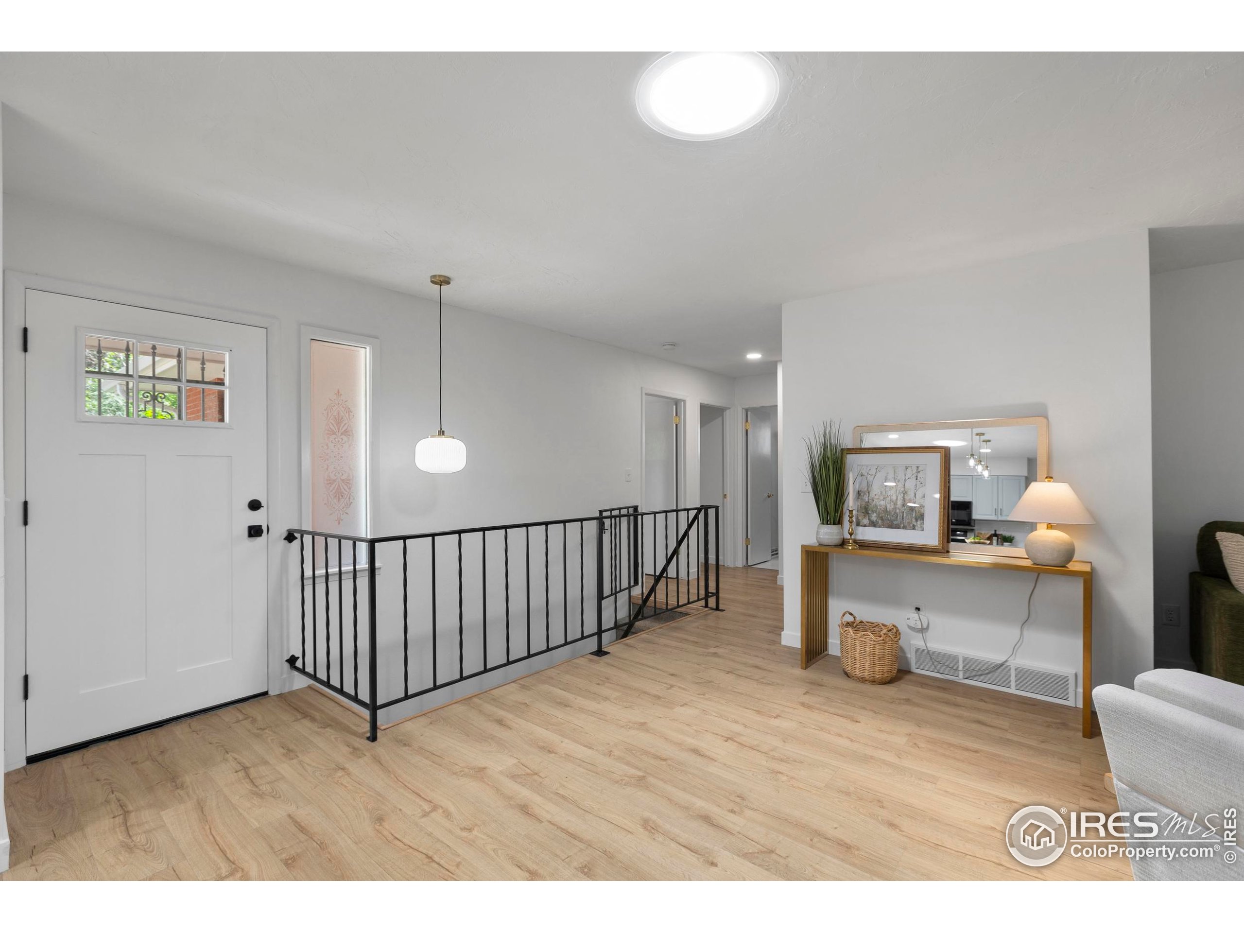 1917 South Lemay Avenue Fort Collins, CO 80525 - Photo 30 of 50 a living room with furniture and a wooden floor