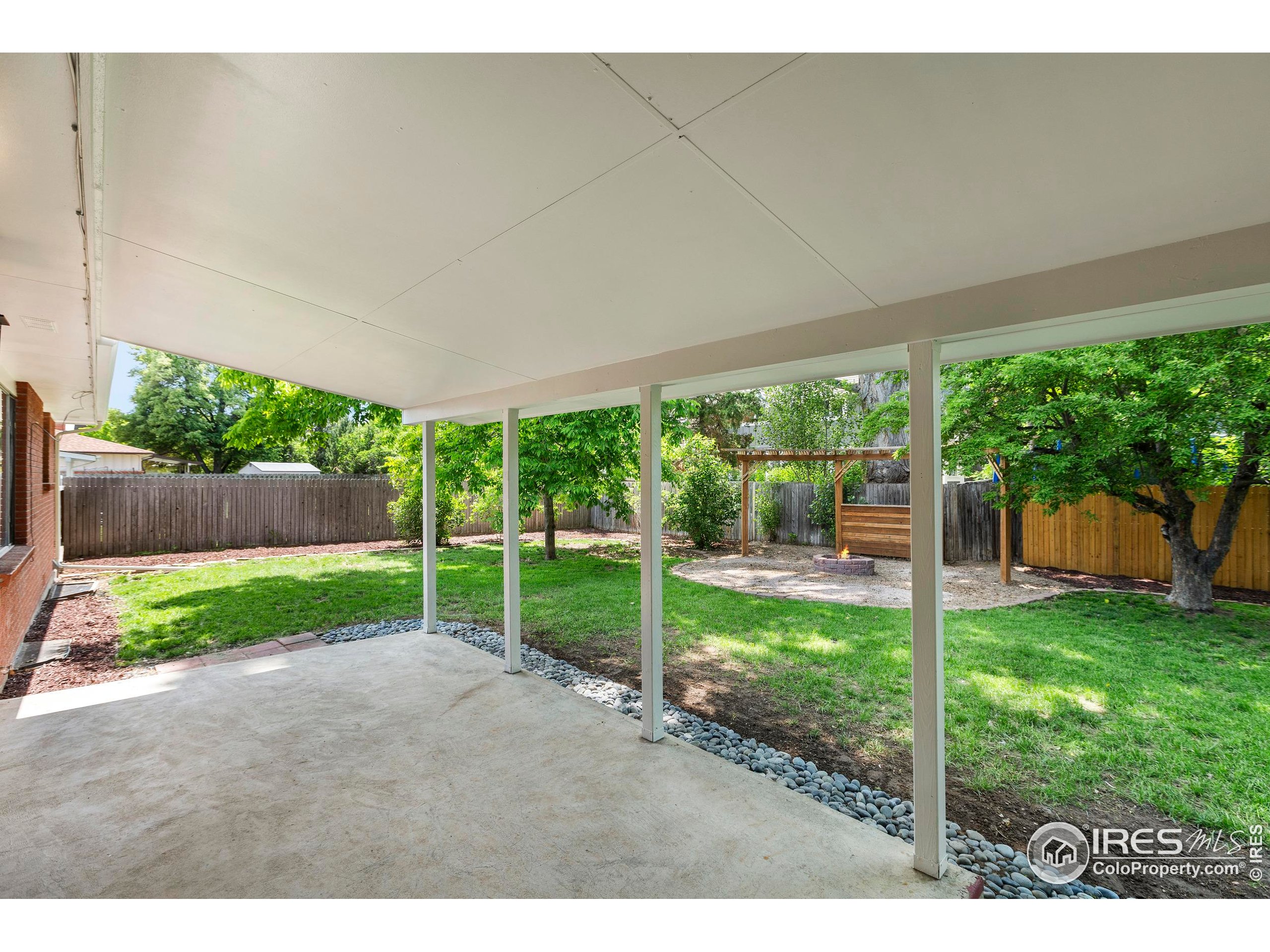 1917 South Lemay Avenue Fort Collins, CO 80525 - Photo 37 of 50 a view of a backyard with couches plants and large trees