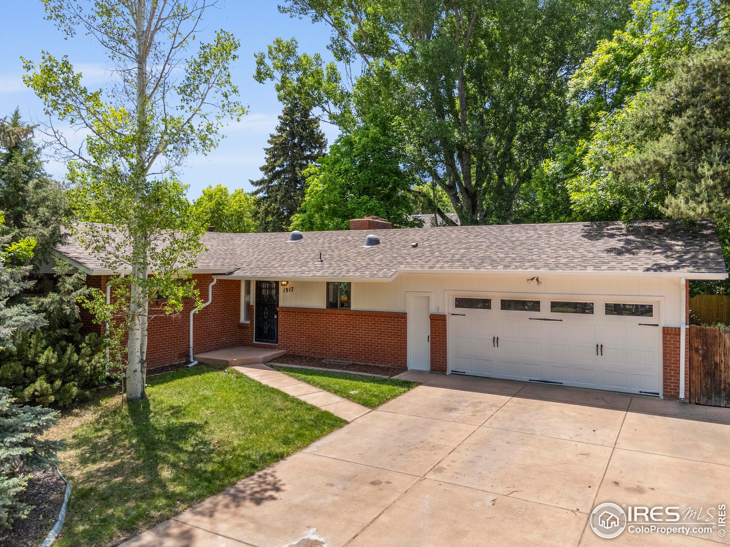 1917 South Lemay Avenue Fort Collins, CO 80525 - Photo 50 of 50 a view of a house with a yard and a large tree