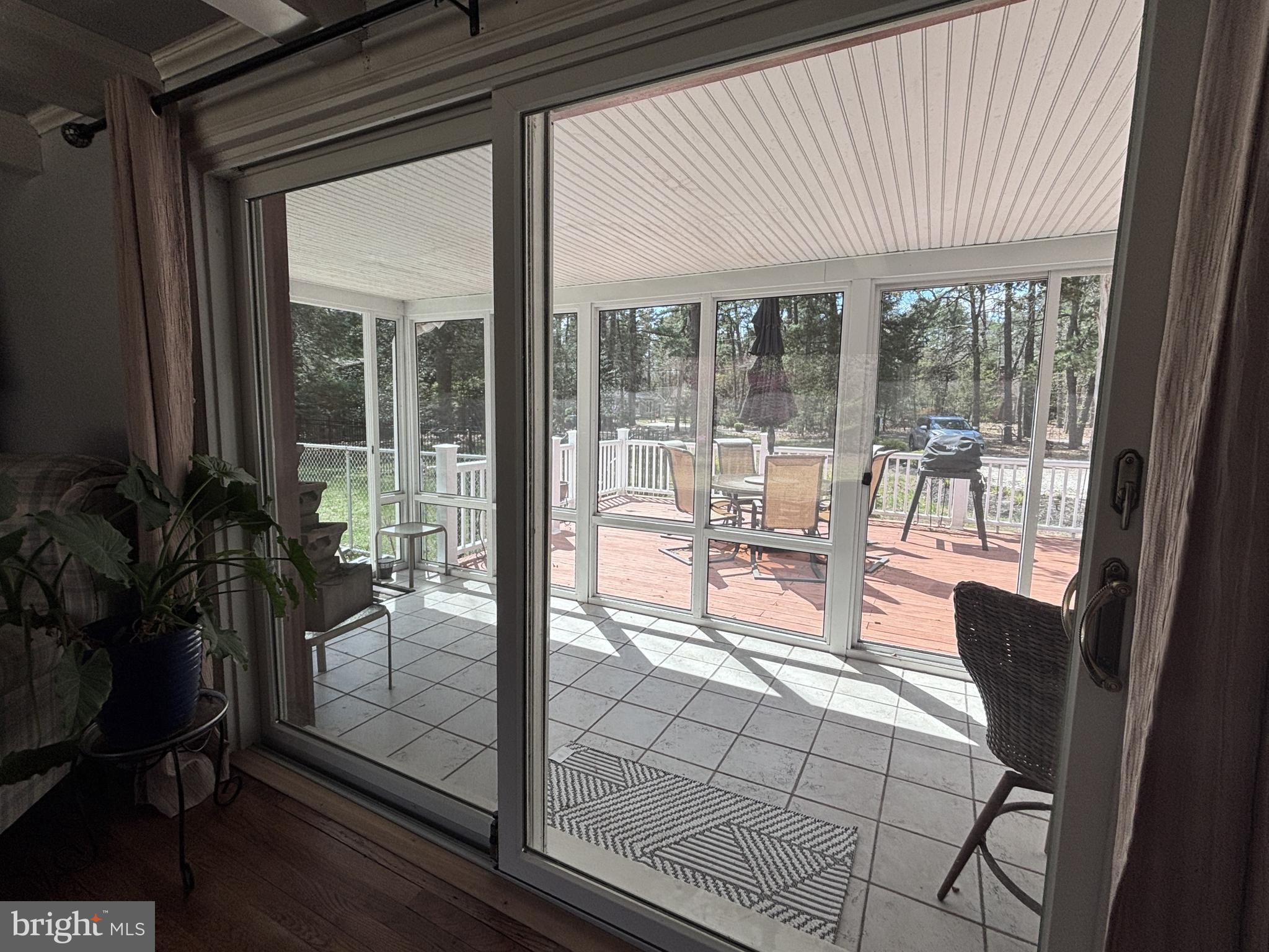 253 Hopewell Road Medford, NJ 08055 - Photo 19 of 50 a room with patio furniture and floor to ceiling window