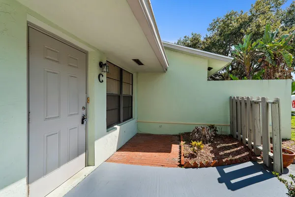a room with pool table and a potted plant
