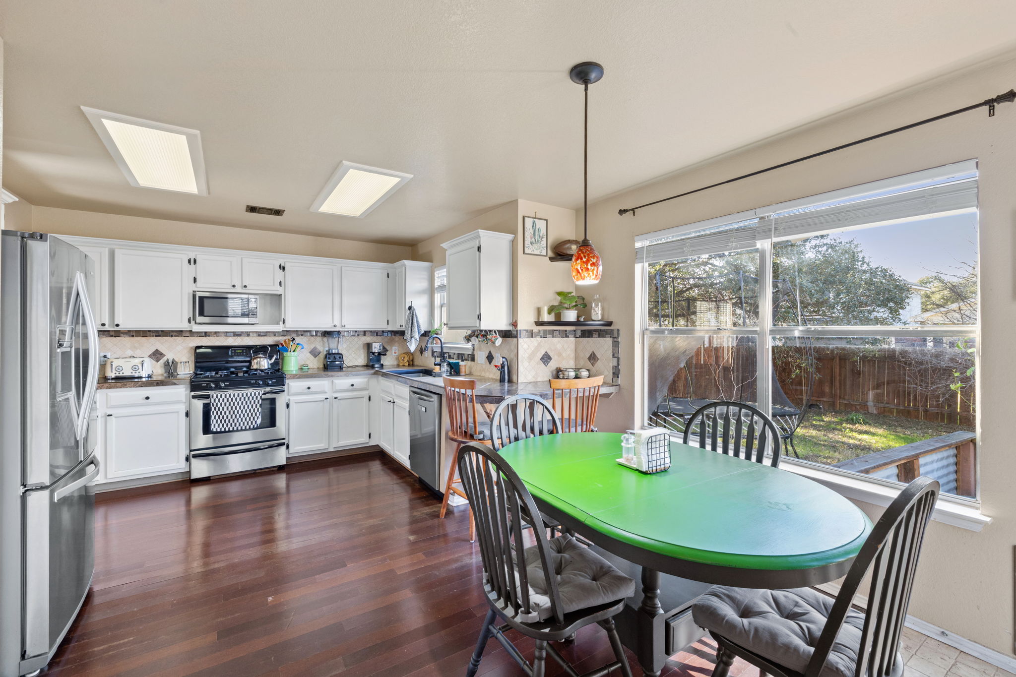 17536 Bishopsgate Drive Pflugerville, TX 78660 - Photo 11 of 28 Dining area featuring dark wood-style floors