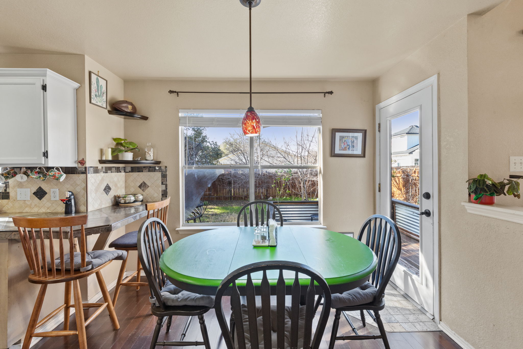 17536 Bishopsgate Drive Pflugerville, TX 78660 - Photo 14 of 28 Dining area with dark wood-style floors and baseboards