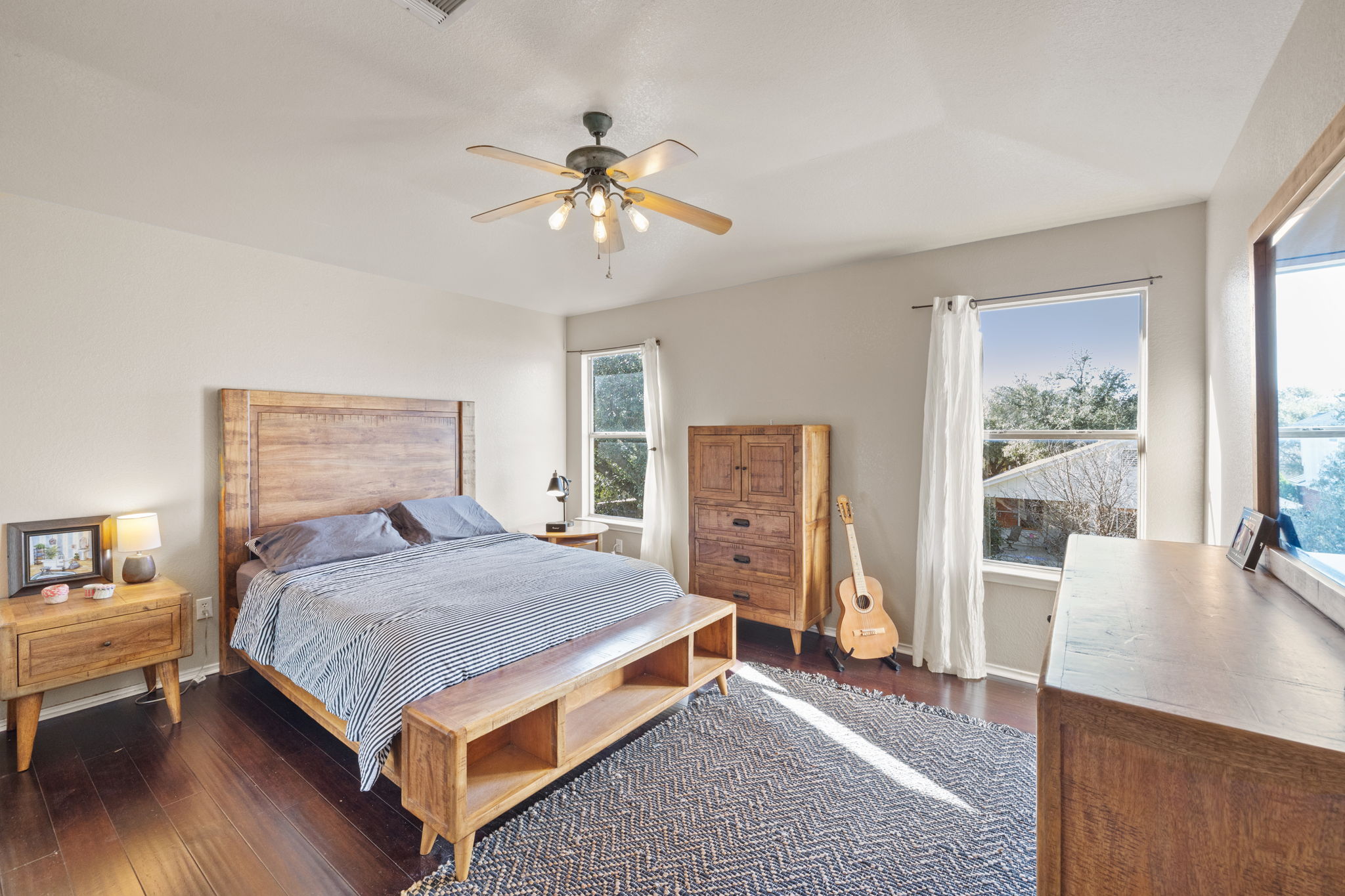 17536 Bishopsgate Drive Pflugerville, TX 78660 - Photo 18 of 28 Bedroom with dark wood-type flooring and ceiling fan