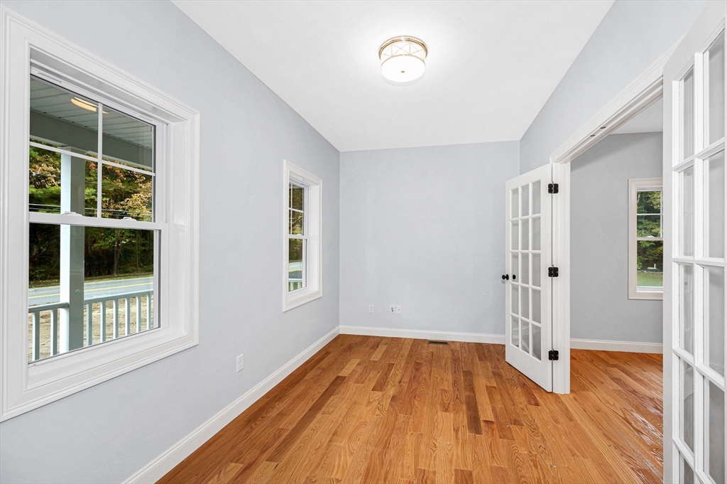 15 Norris Road Tyngsborough, MA 01879 - Photo 17 of 42 a view of a room with wooden floor and windows
