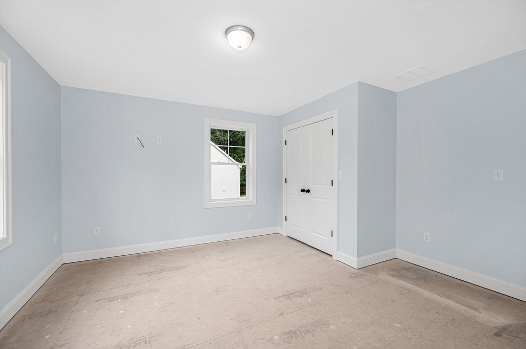 15 Norris Road Tyngsborough, MA 01879 - Photo 18 of 42 an empty room with windows and closet