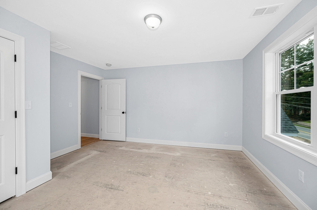 15 Norris Road Tyngsborough, MA 01879 - Photo 19 of 42 a view of an empty room with windows