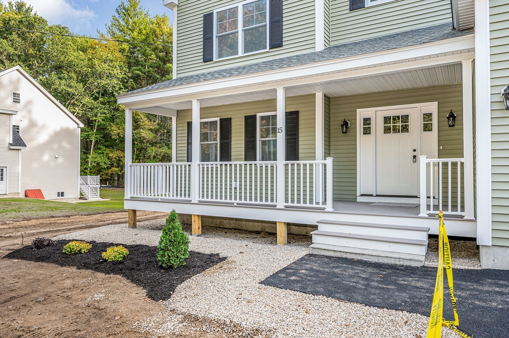 15 Norris Road Tyngsborough, MA 01879 - Photo 2 of 42 a front view of a house with garden