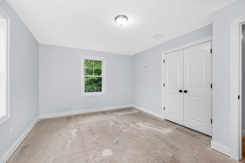 15 Norris Road Tyngsborough, MA 01879 - Photo 21 of 42 a view of an empty room with a window