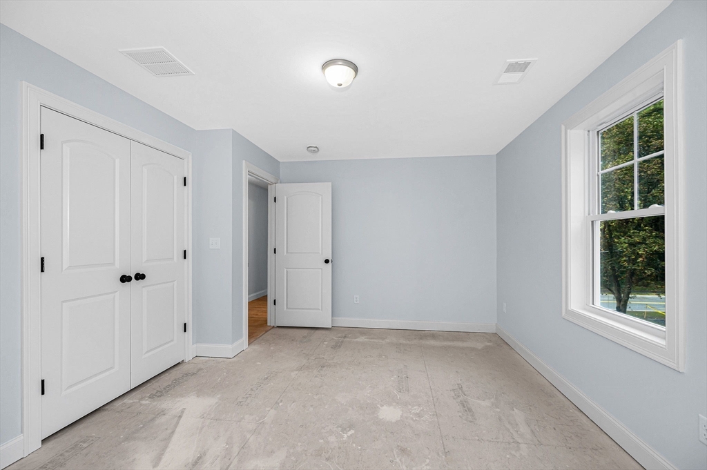 15 Norris Road Tyngsborough, MA 01879 - Photo 22 of 42 a view of an empty room with a window