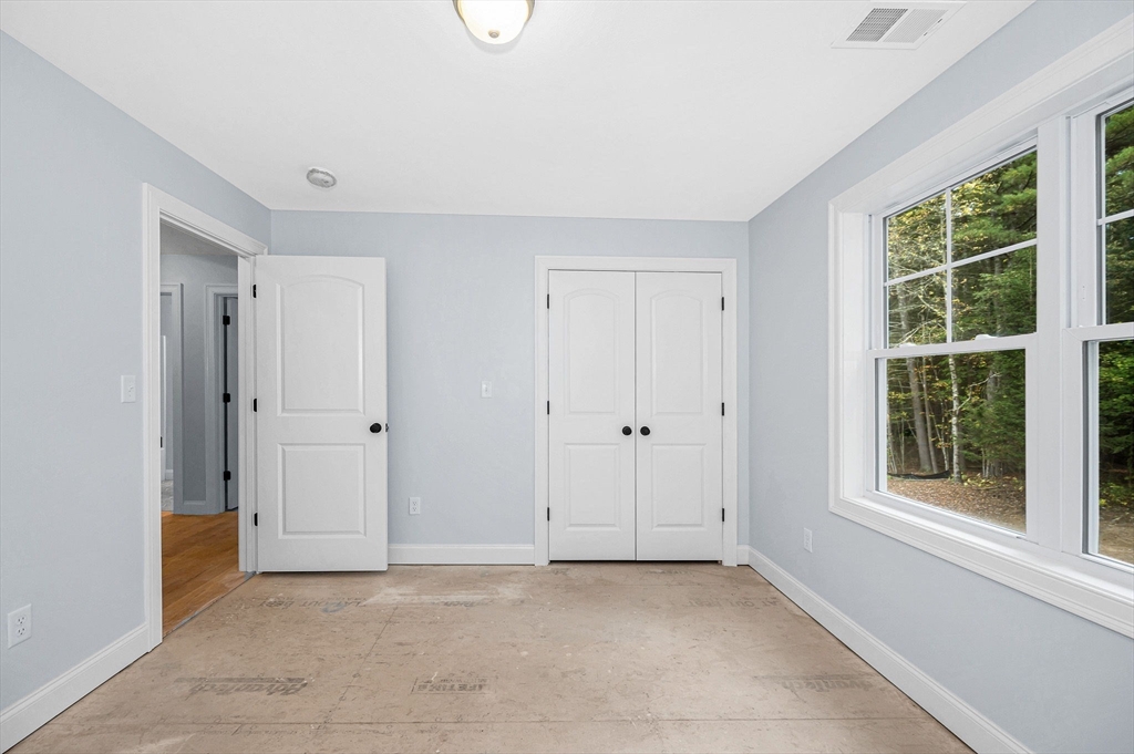 15 Norris Road Tyngsborough, MA 01879 - Photo 24 of 42 a view of an empty room with a window