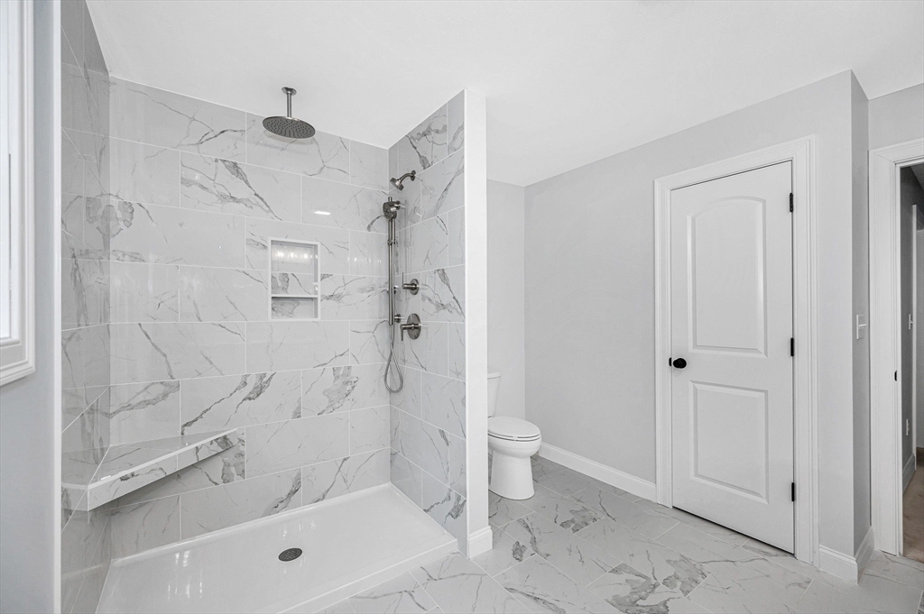 15 Norris Road Tyngsborough, MA 01879 - Photo 31 of 42 a bathroom with a shower a toilet and a shower