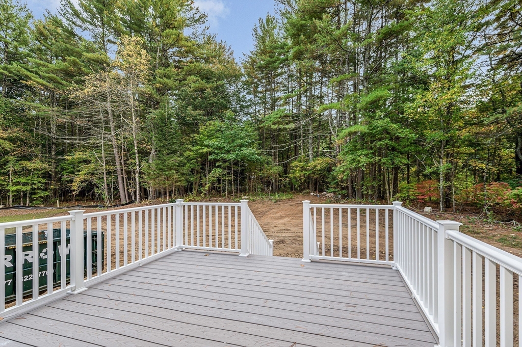 15 Norris Road Tyngsborough, MA 01879 - Photo 34 of 42 a view of deck with wooden floor and fence