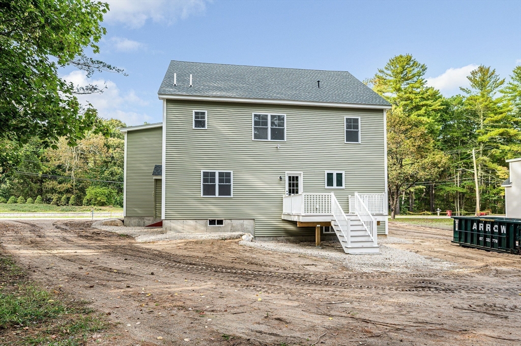15 Norris Road Tyngsborough, MA 01879 - Photo 39 of 42 a backyard of a house with outdoor seating