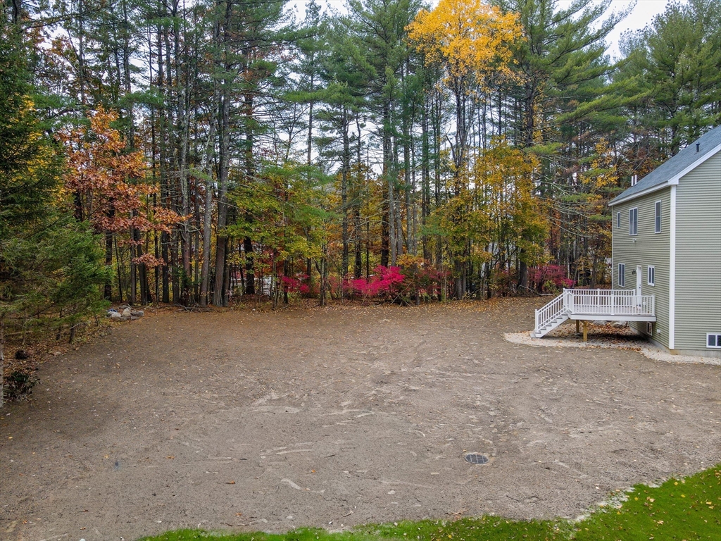 15 Norris Road Tyngsborough, MA 01879 - Photo 40 of 42 a view of a park with plants and trees