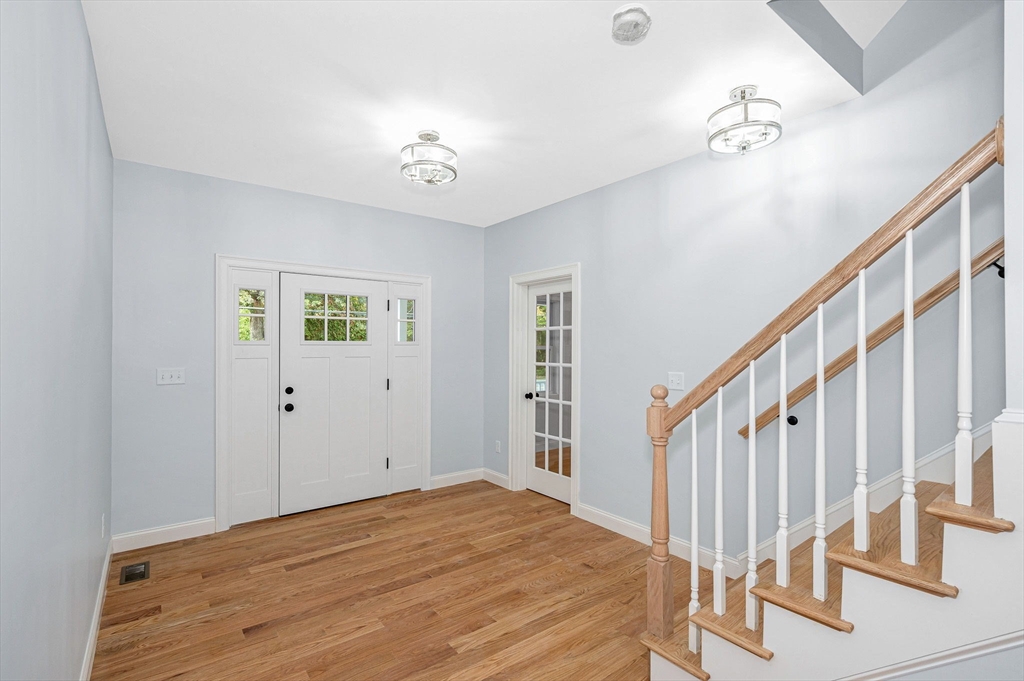 15 Norris Road Tyngsborough, MA 01879 - Photo 4 of 42 a view of an entryway with wooden floor