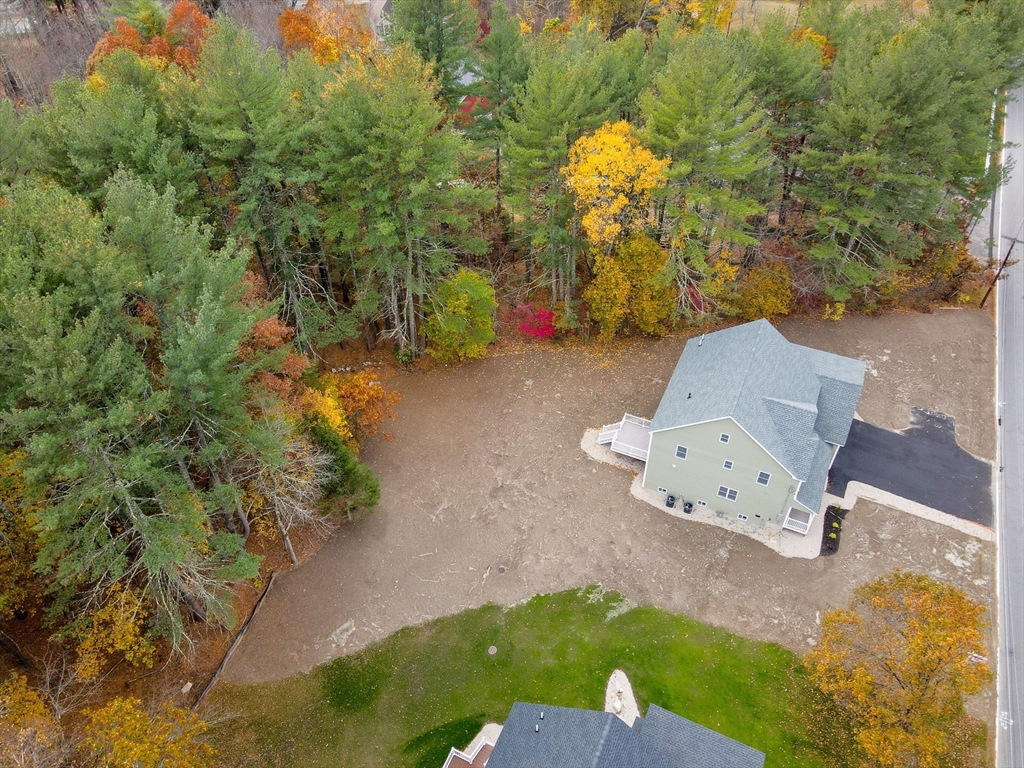 15 Norris Road Tyngsborough, MA 01879 - Photo 41 of 42 an aerial view of a house with swimming pool and big yard