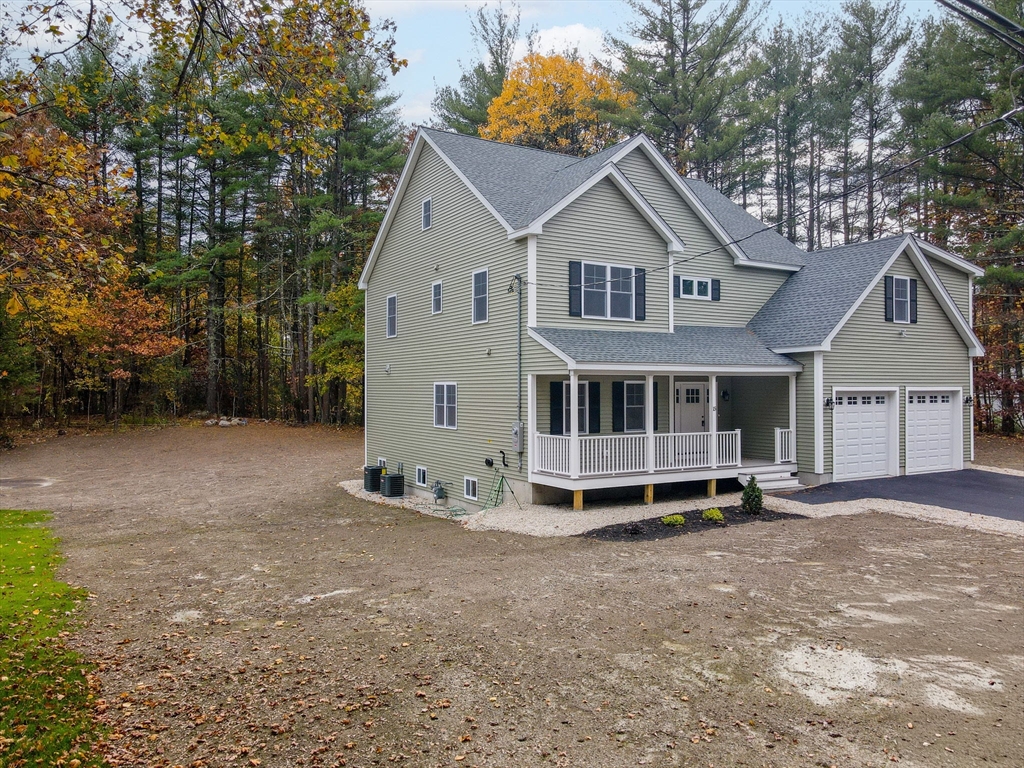 15 Norris Road Tyngsborough, MA 01879 - Photo 42 of 42 a view of a house with a yard and large trees