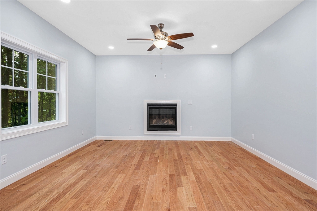 15 Norris Road Tyngsborough, MA 01879 - Photo 8 of 42 a view of empty room with wooden floor and fan