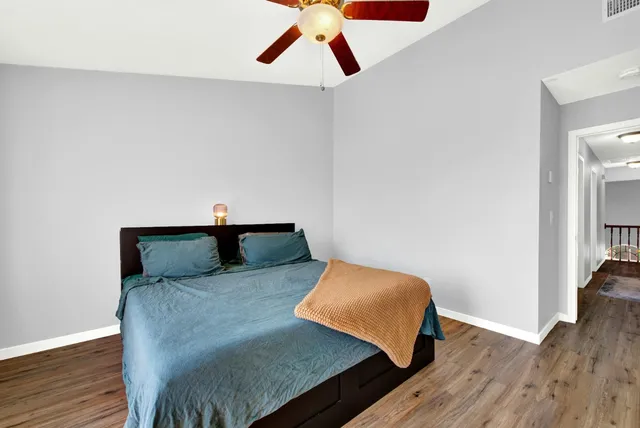a view of a livingroom with wooden floor and a window