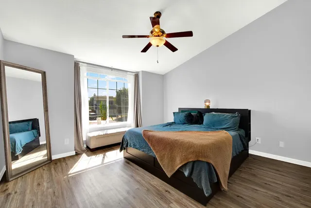 a view of a room with wooden floor