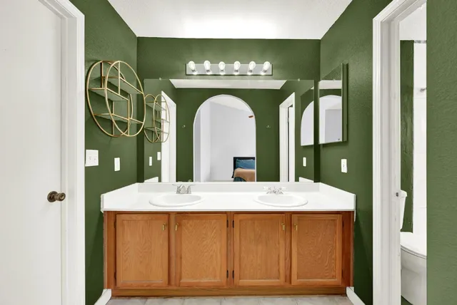 an aerial view of residential house with outdoor space and swimming pool