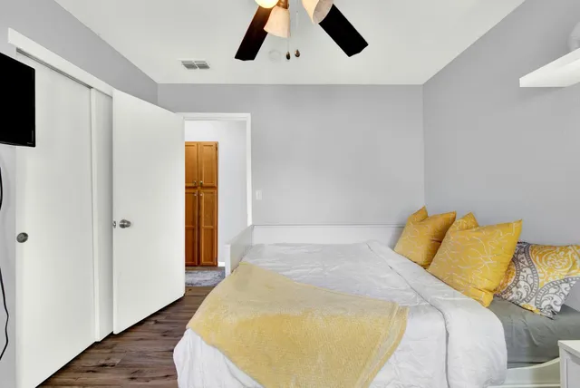 a view of an outdoor sitting area with furniture and umbrella