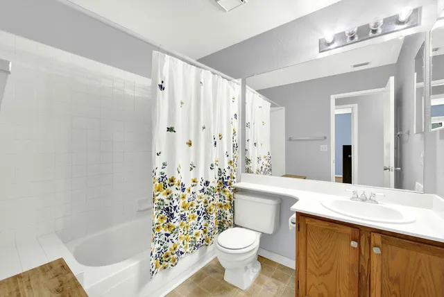 an aerial view of residential houses with outdoor space