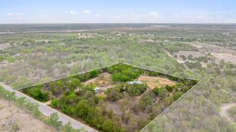 an aerial view of residential house with outdoor space