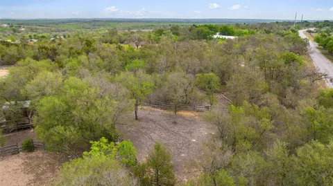 a view of a yard with some trees