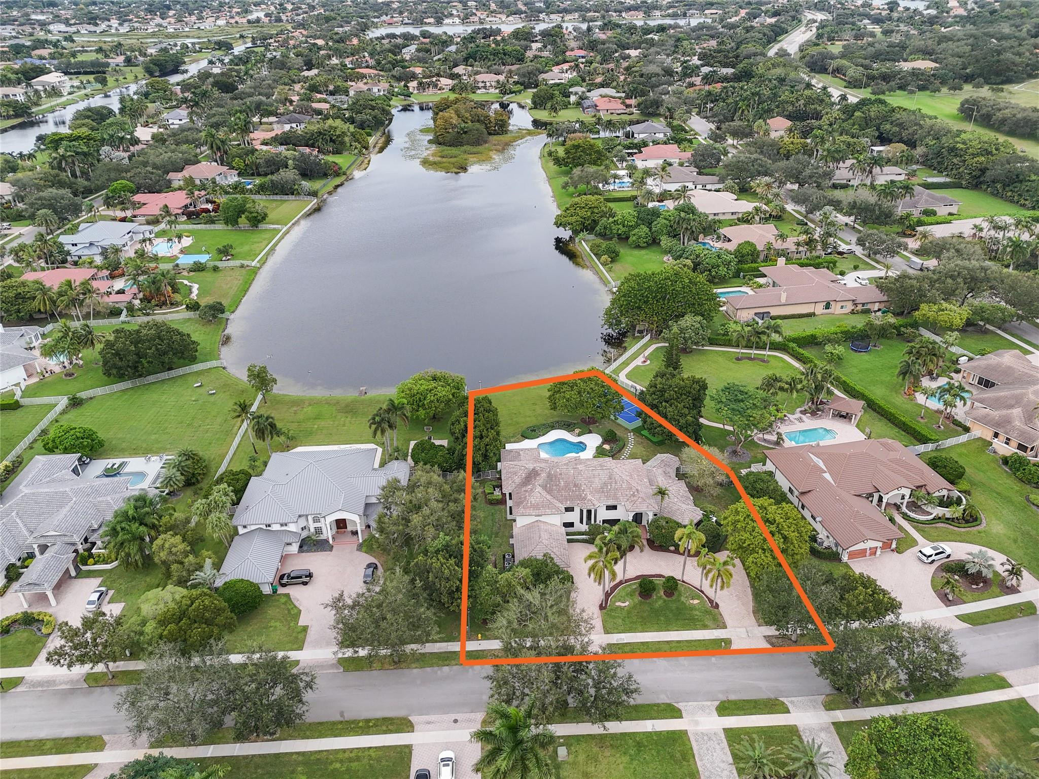 an aerial view of house with yard swimming pool and outdoor seating