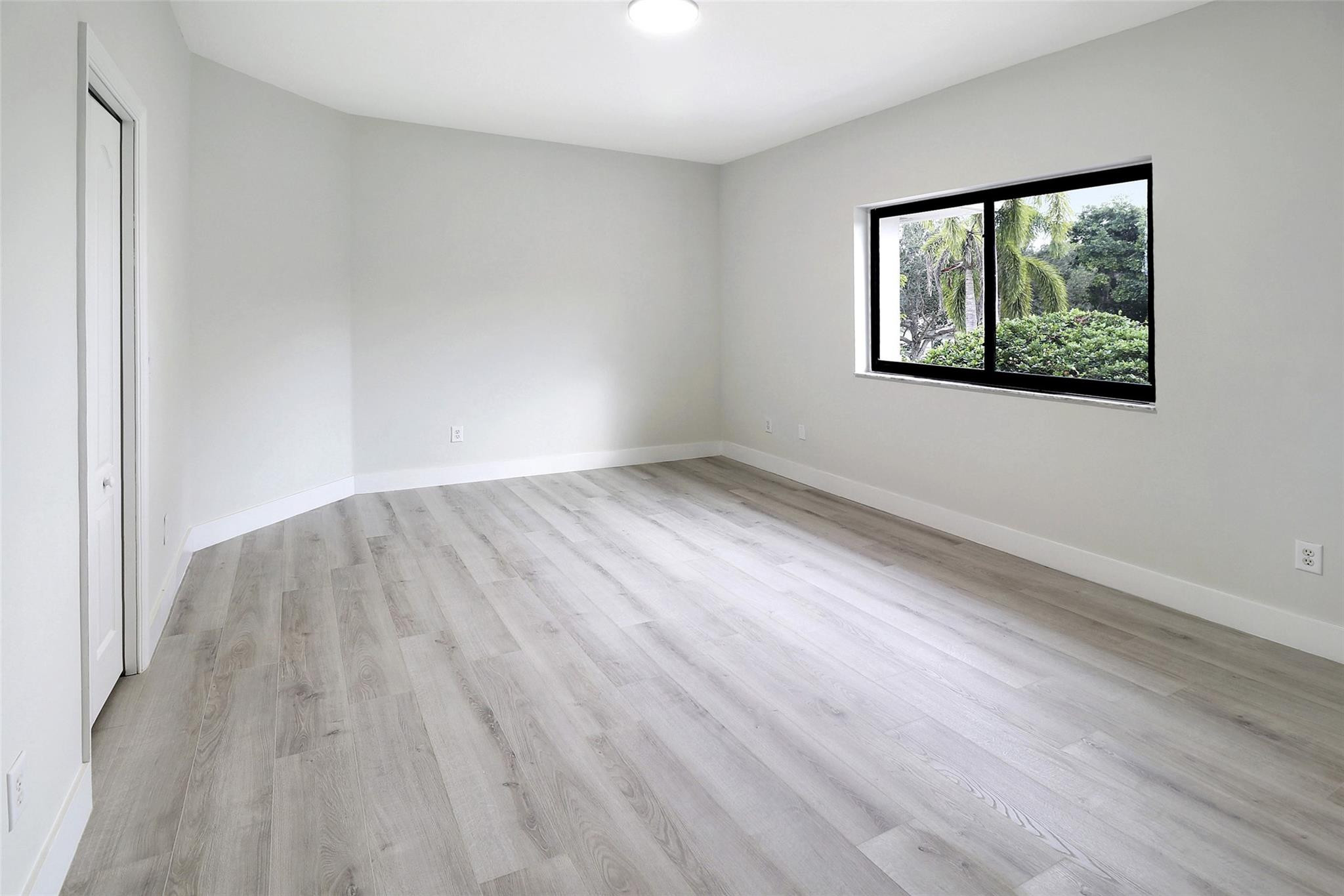 10303 Southwest 26th Street Davie, FL 33324 - Photo 29 of 42 wooden floor in an empty room with a window