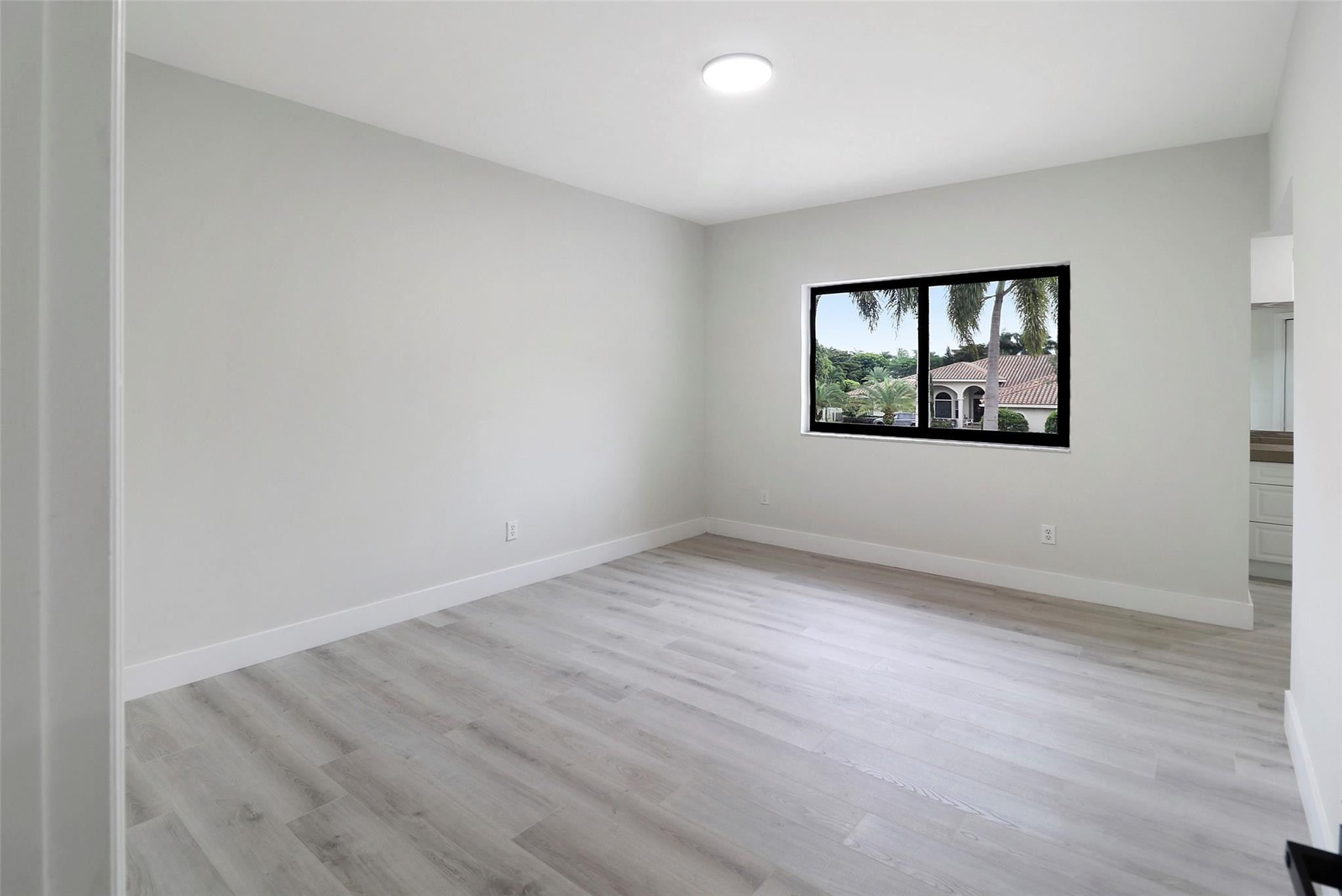 10303 Southwest 26th Street Davie, FL 33324 - Photo 31 of 42 an empty room with a window