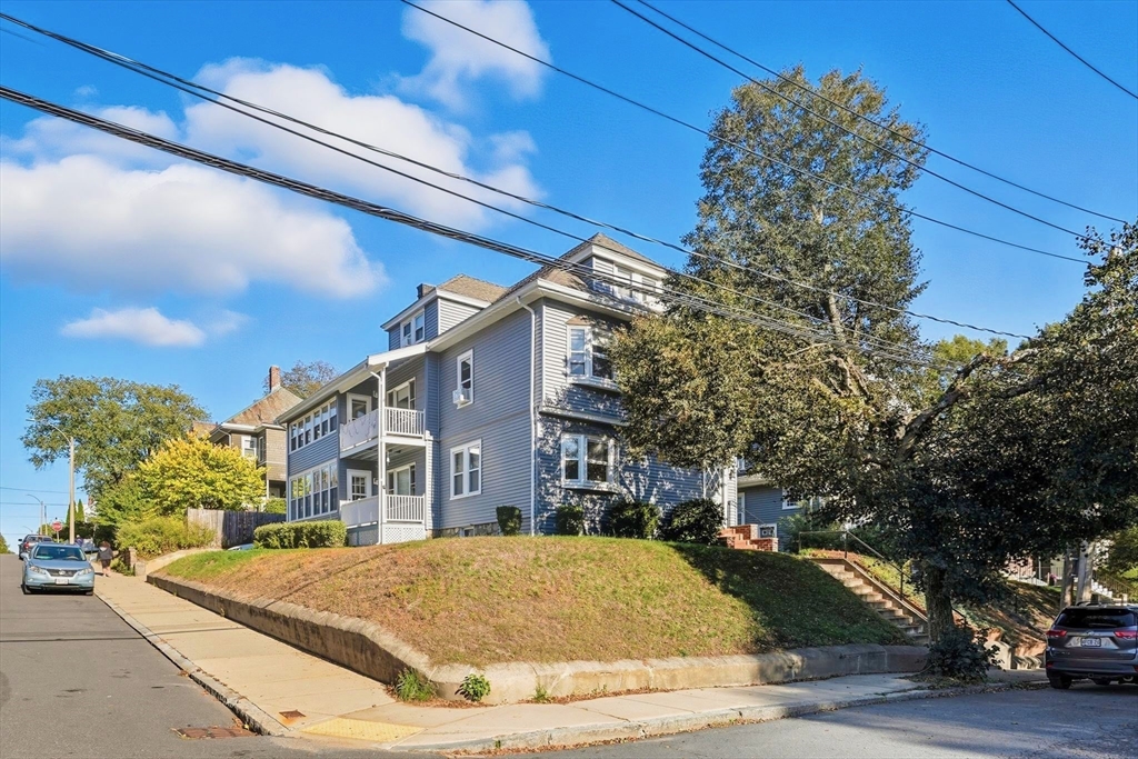 121-123 Willow Street, Unit 2 Boston, MA 02132 - Photo 1 of 8 a house view with a outdoor space