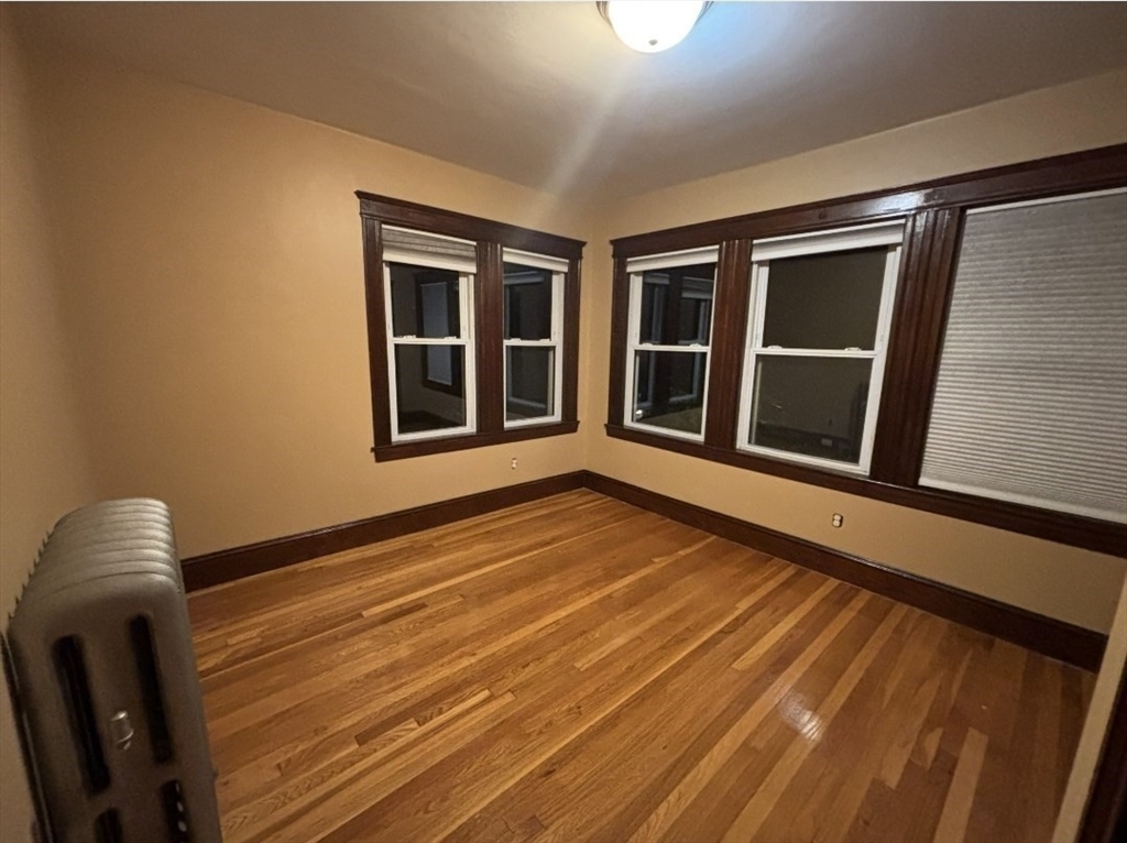 121-123 Willow Street, Unit 2 Boston, MA 02132 - Photo 6 of 8 a view of an empty room with a window