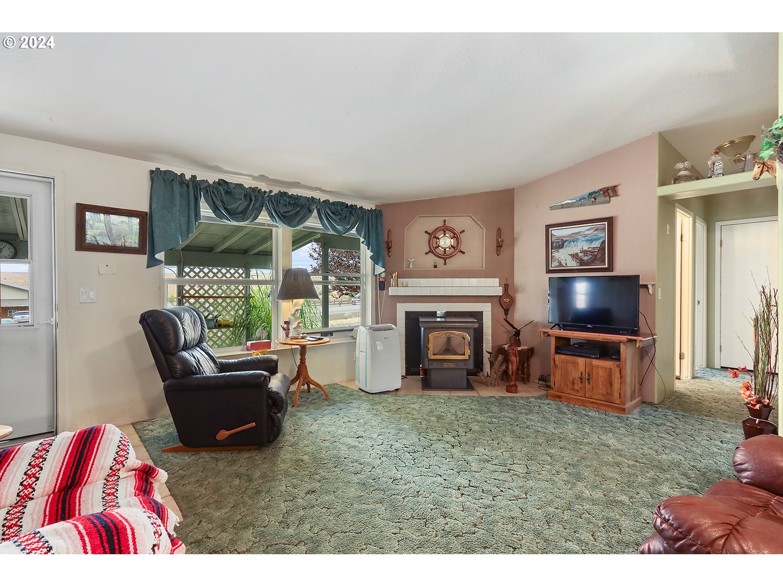 1206 Highway 197 Maupin, OR 97037 - Photo 2 of 31 a living room with furniture and a fireplace
