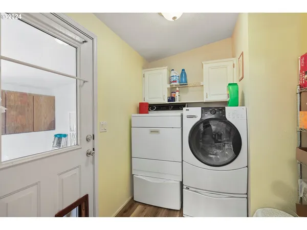 a utility room with sink dryer and washer