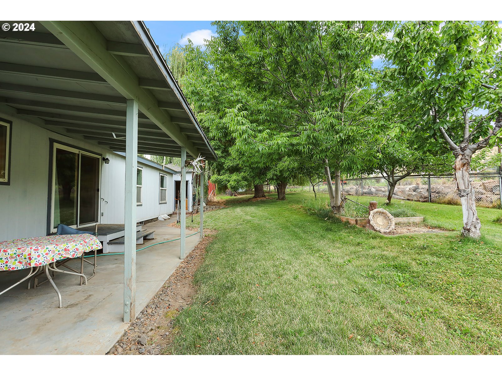 1206 Highway 197 Maupin, OR 97037 - Photo 26 of 31 a view of a house with backyard porch and sitting area