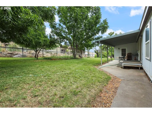 a view of a backyard with a garden