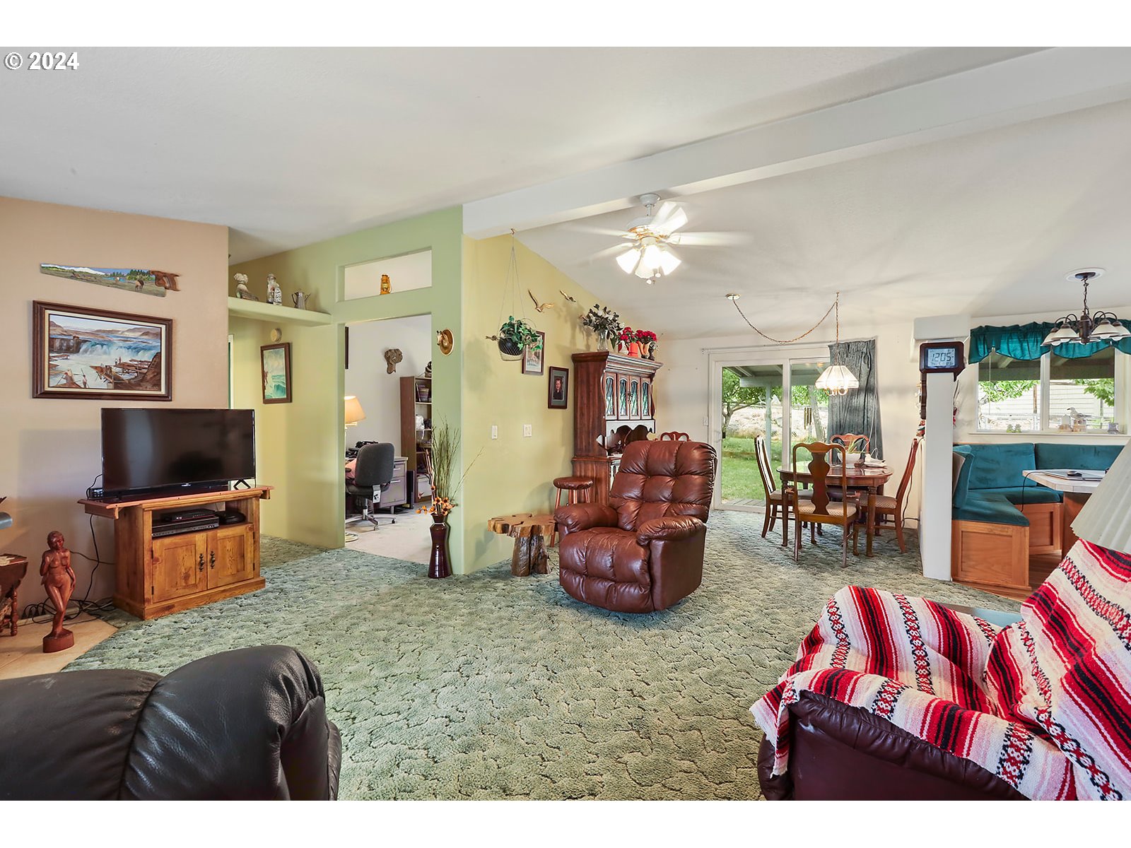 1206 Highway 197 Maupin, OR 97037 - Photo 3 of 31 a living room with furniture and a flat screen tv